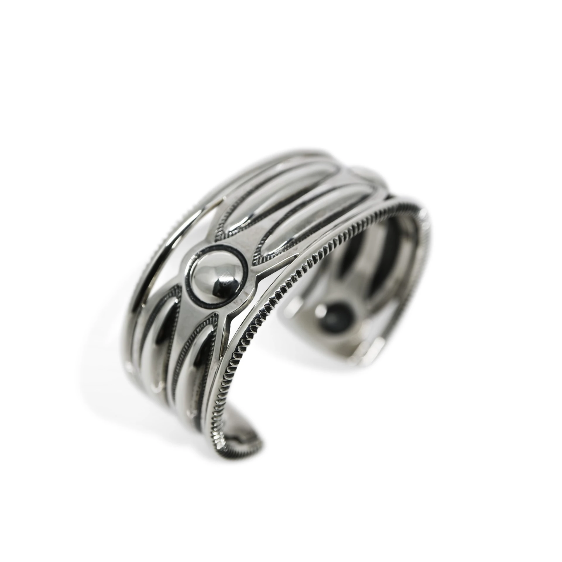 CUT OUT LONG OVAL W / MOONS COIN EDGE CUFF
