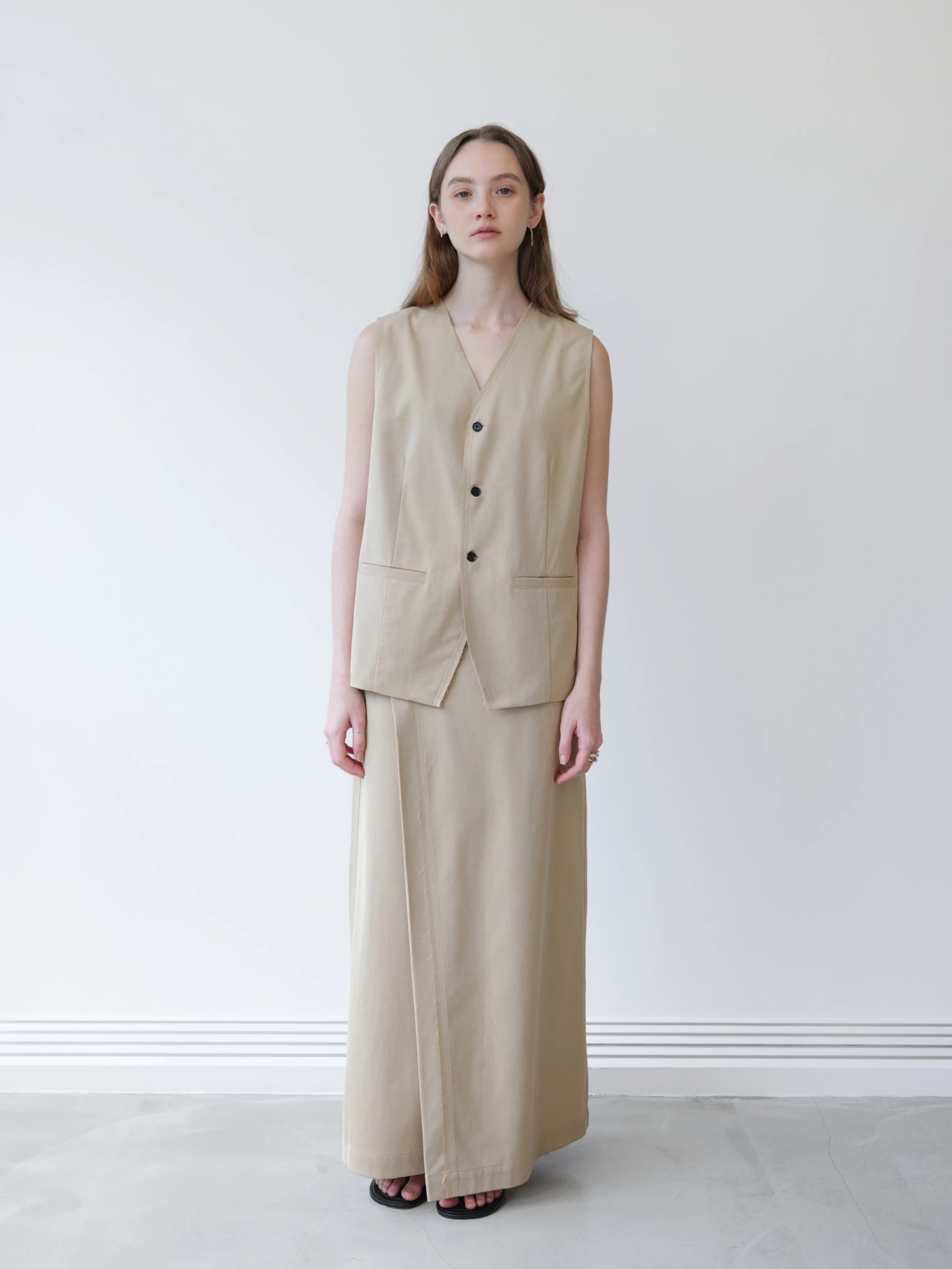 LoamBud Asymmetric Pleated Skirt in beige