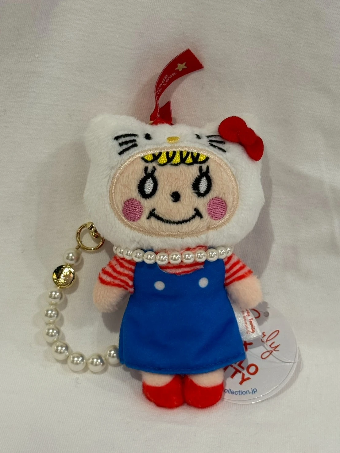 日本代官山卷毛女孩KITTY頭套吊飾
